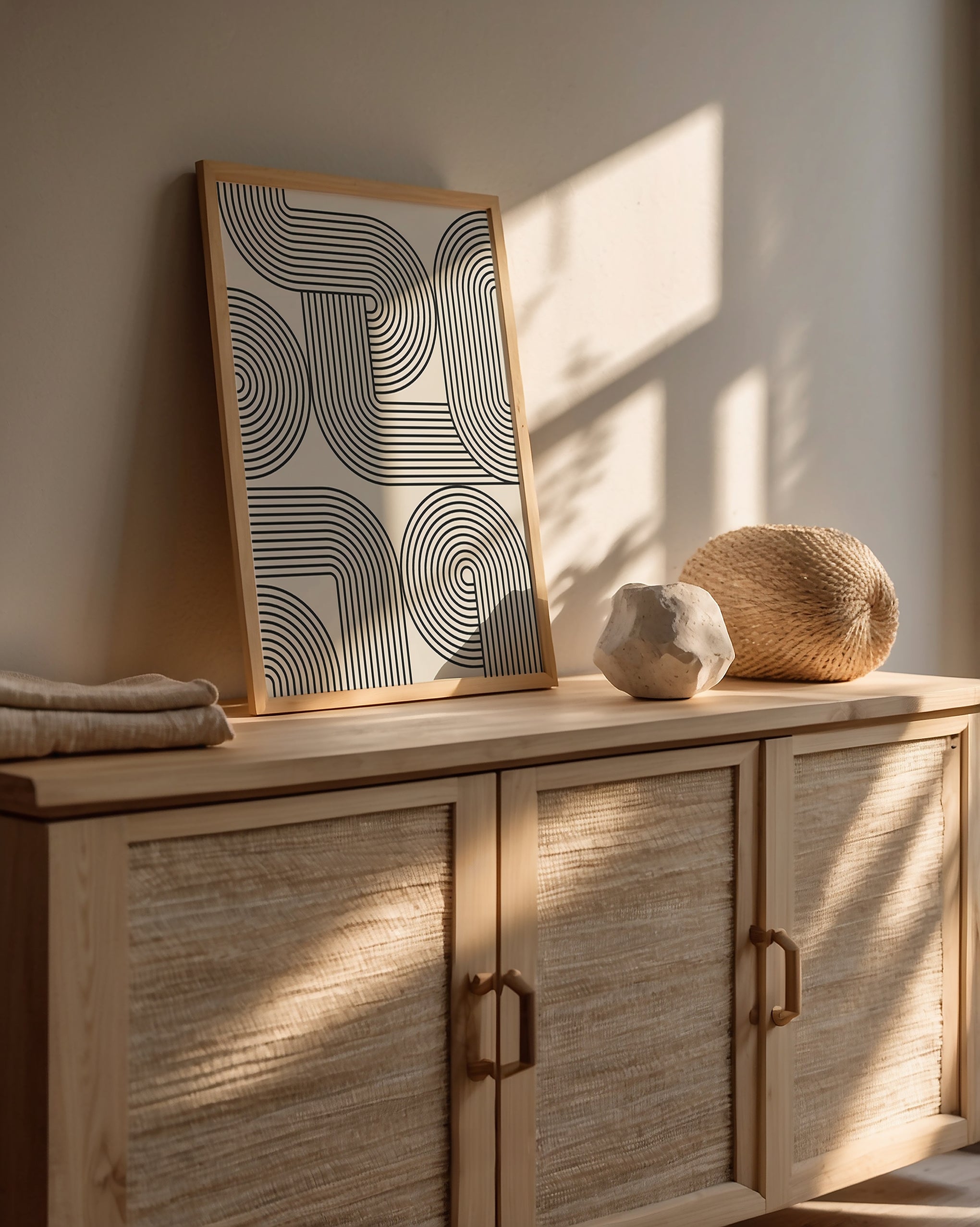 Monoline Motion art print featuring hypnotic black lines on cream background, showcasing Bauhaus design aesthetic.