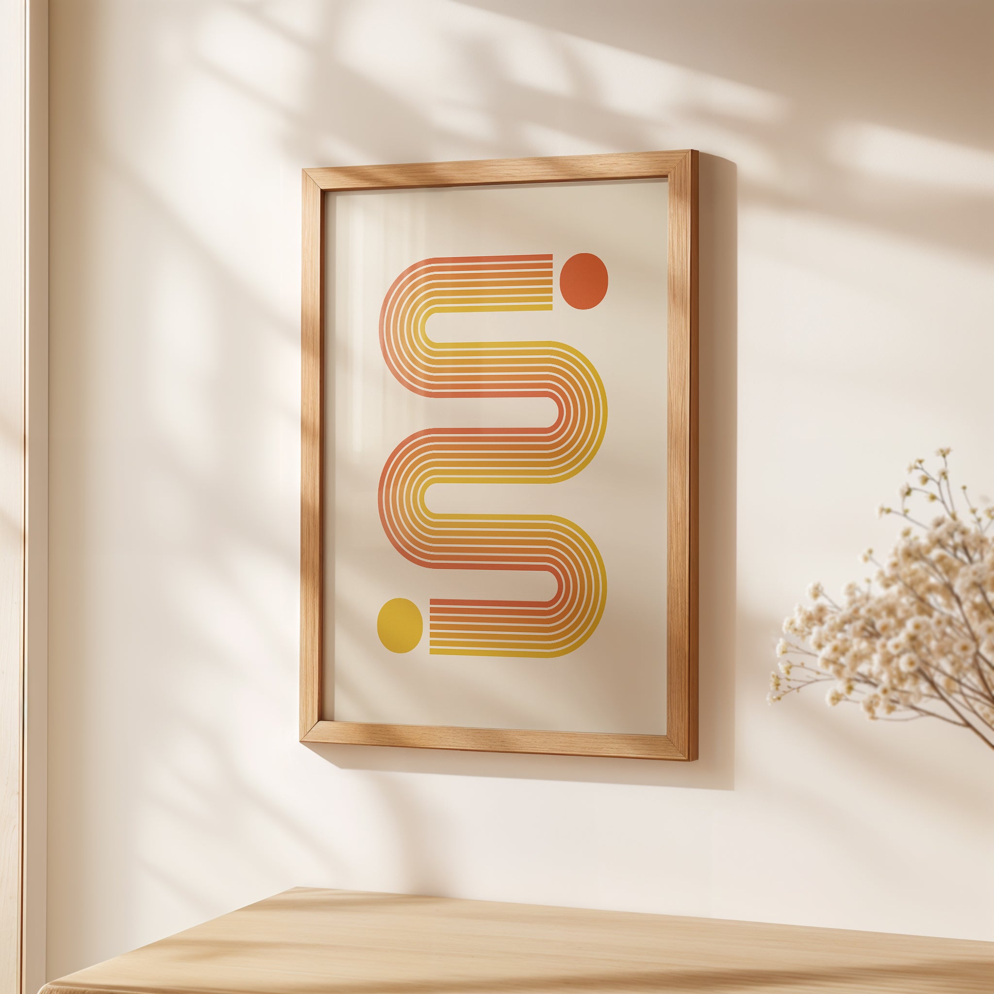 Bauhaus-inspired art print featuring sunset-toned lines in yellow and orange, showcased in a modern framed setting.