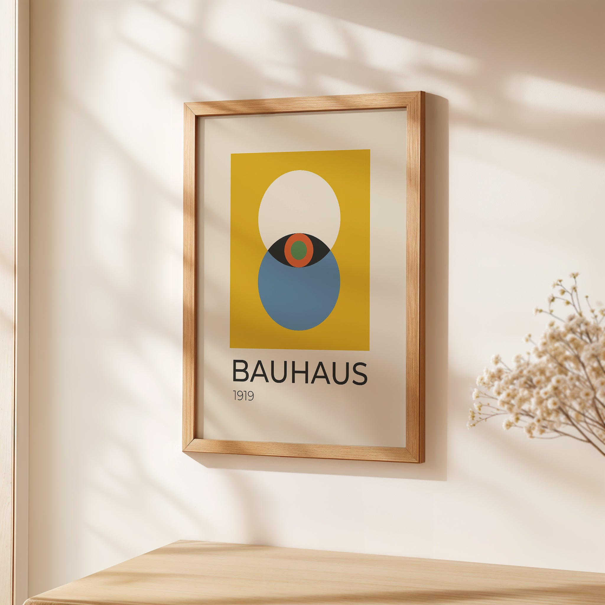 Bauhaus wall art print featuring bold colors and geometric design in a warm wooden frame.