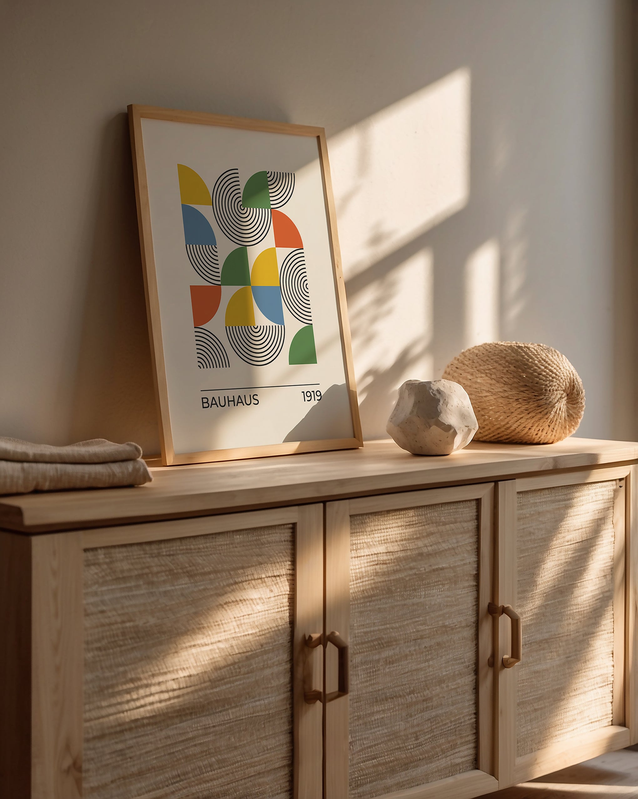 Bauhaus art print 'Color Theory No. 19' featuring geometric forms and vibrant colors on a modern sideboard.