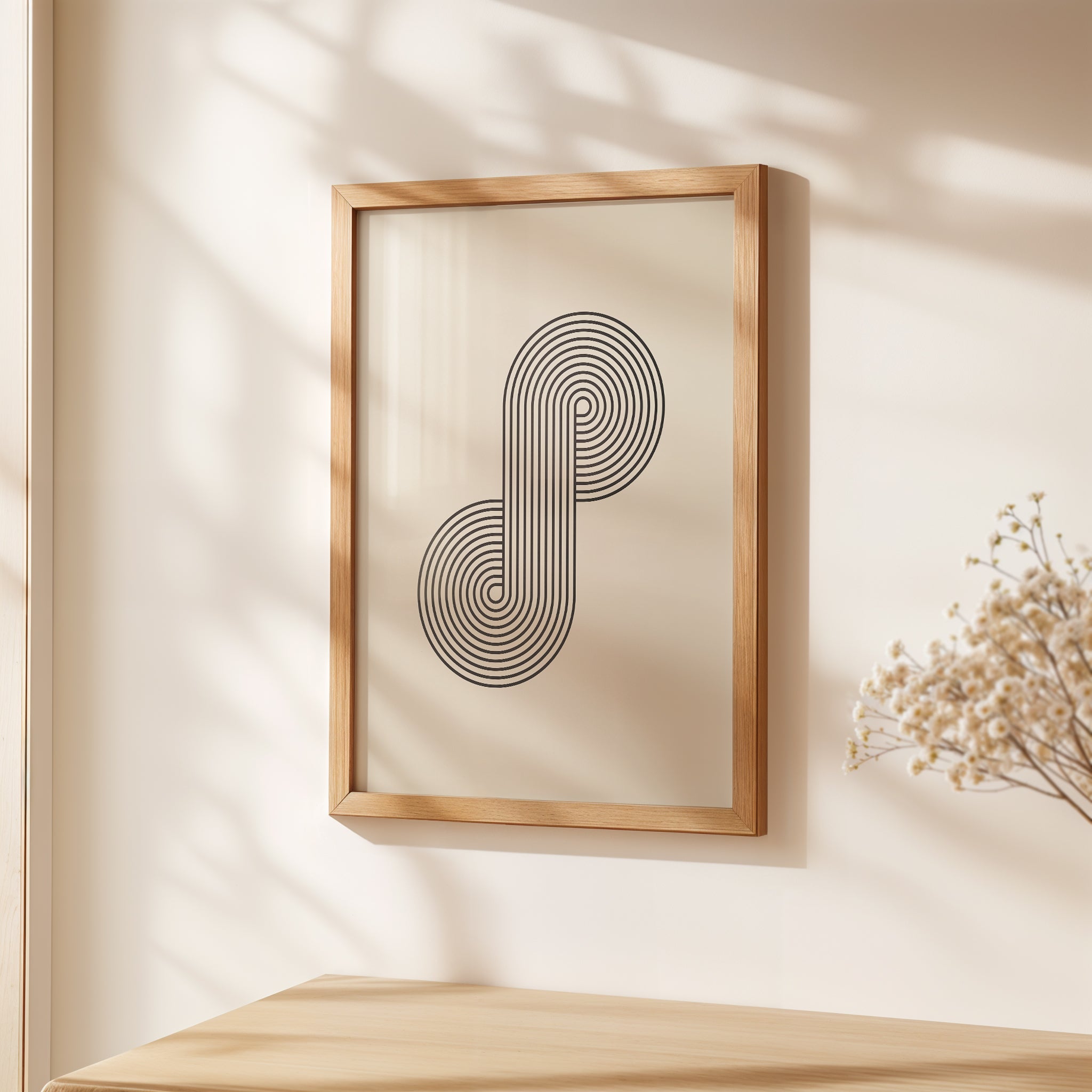 Bauhaus-inspired 'Infinity Loop' wall art print featuring bold black concentric lines in a modern frame.