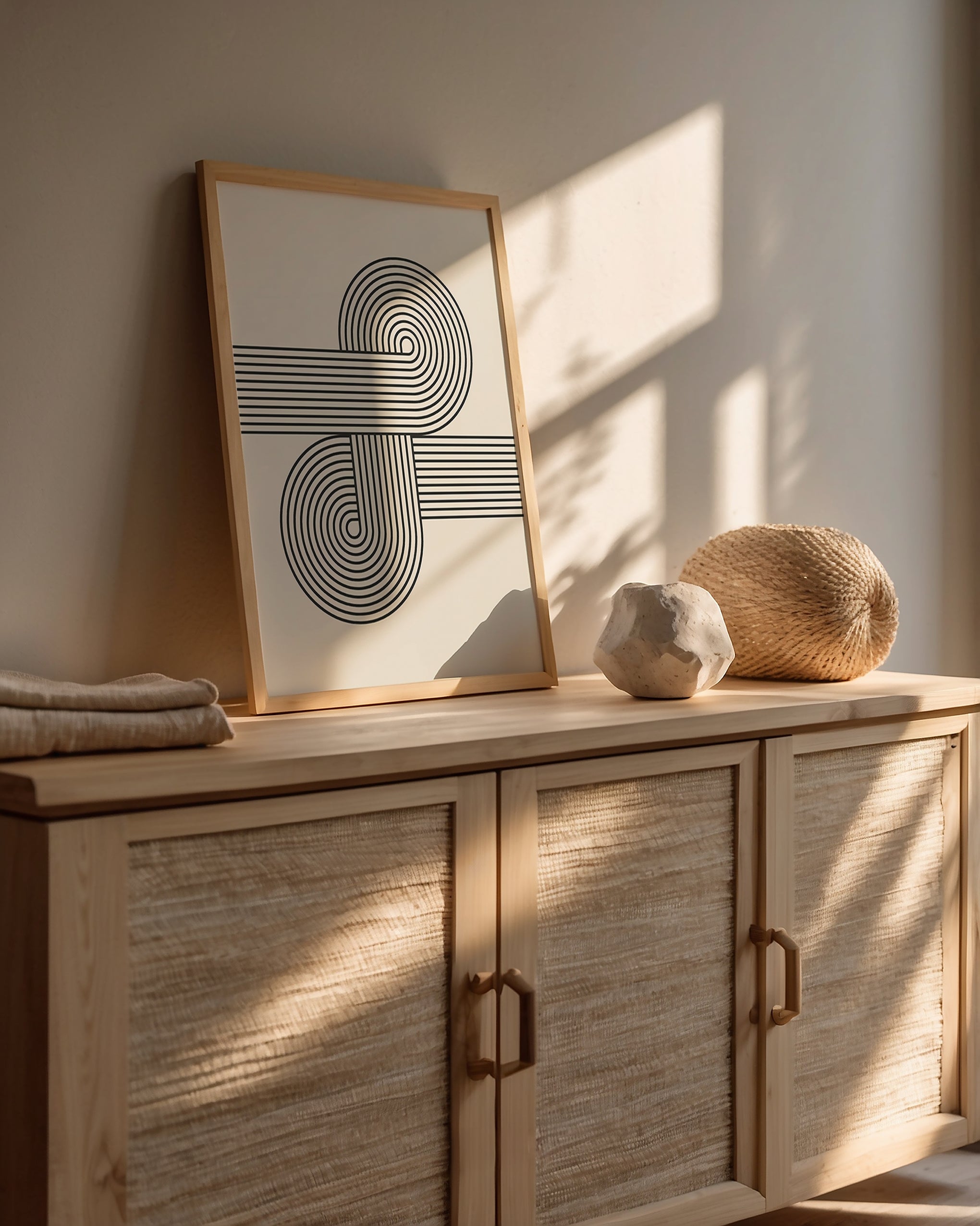 Bauhaus-inspired abstract wall art print with curved lines and natural decor in a modern setting.