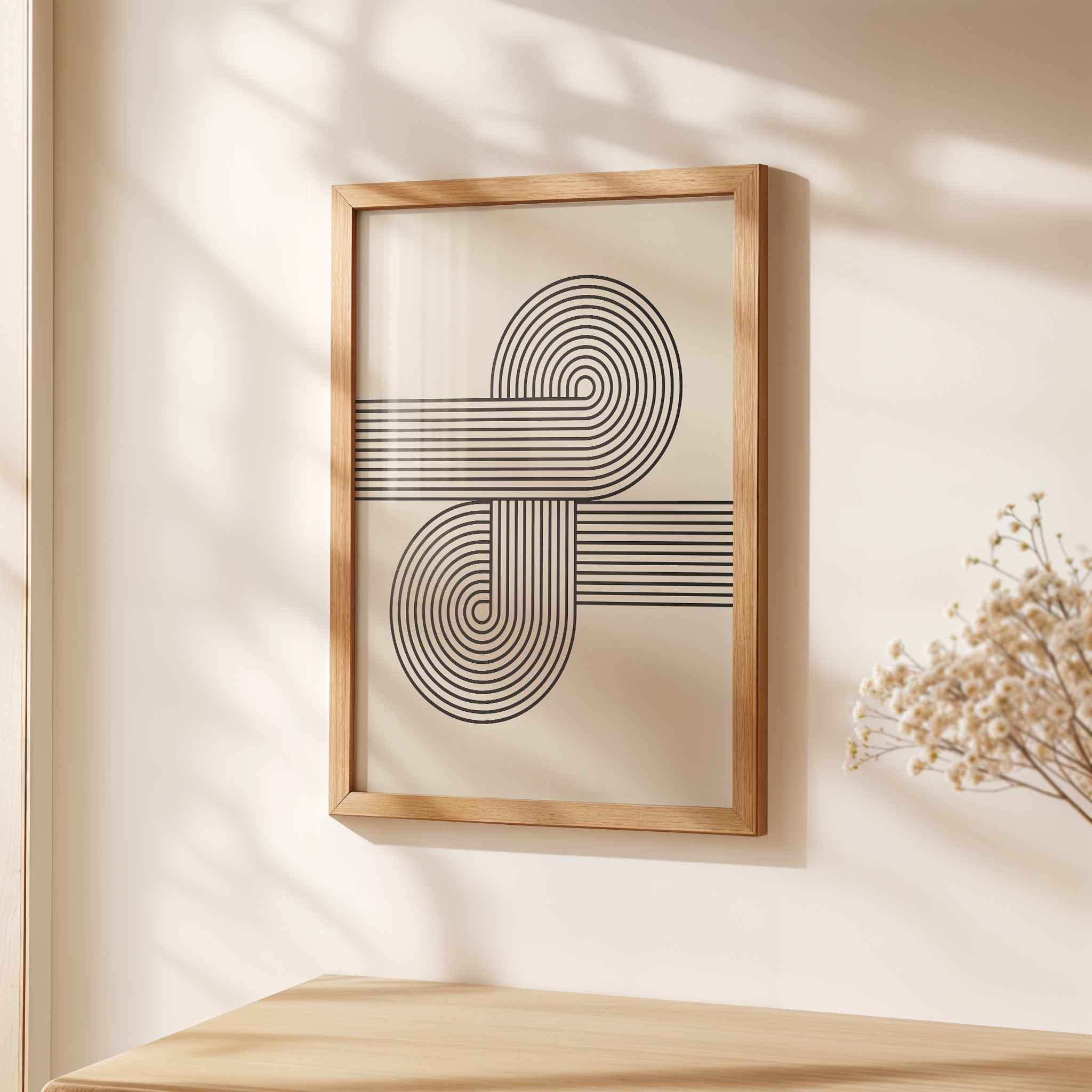 Abstract wall art print in black-and-ivory with curved lines, inspired by Bauhaus design, showcased in a wooden frame.