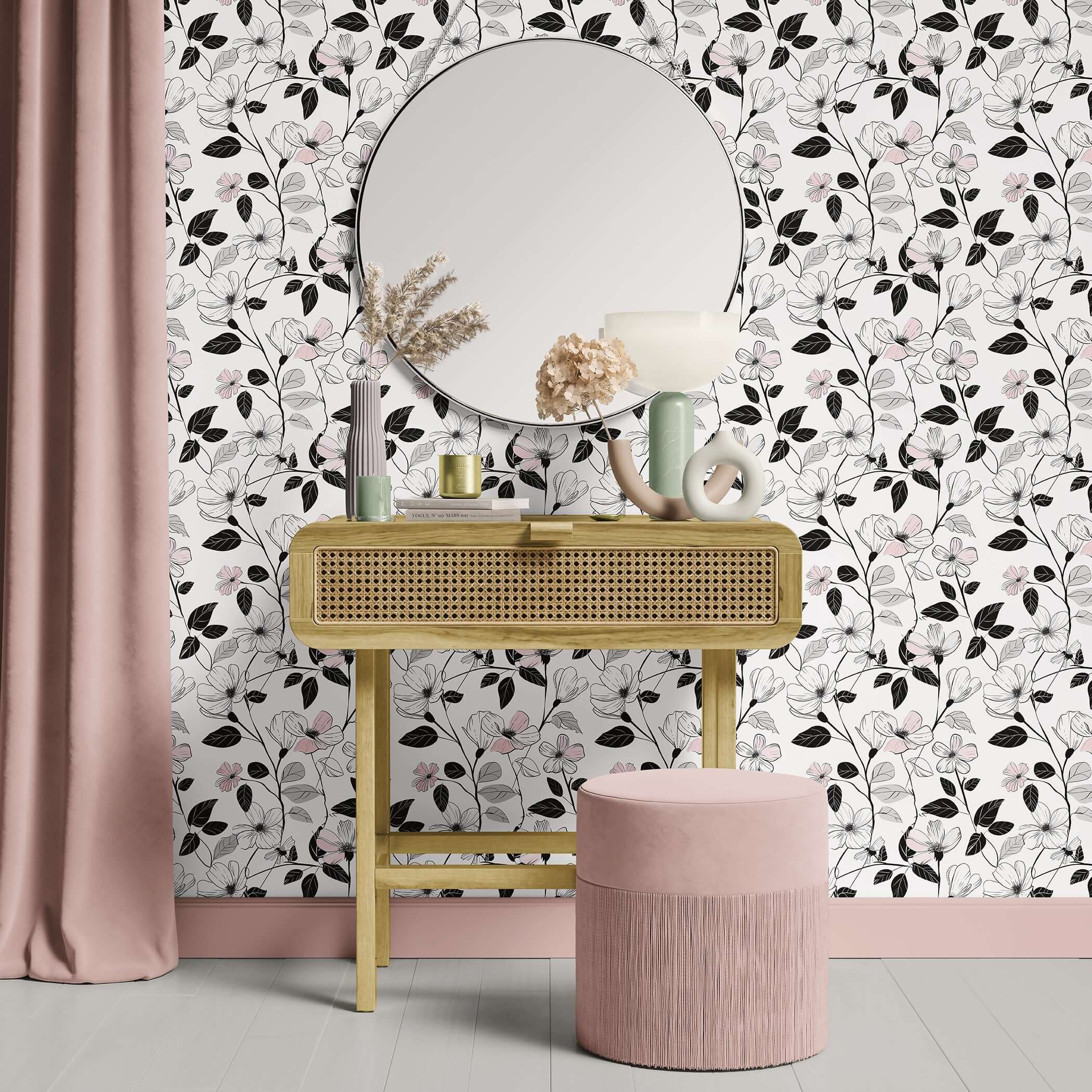Modern monochromatic floral wallpaper in blush and ivory with black foliage, enhancing a stylish vanity setup with mirror and decor.