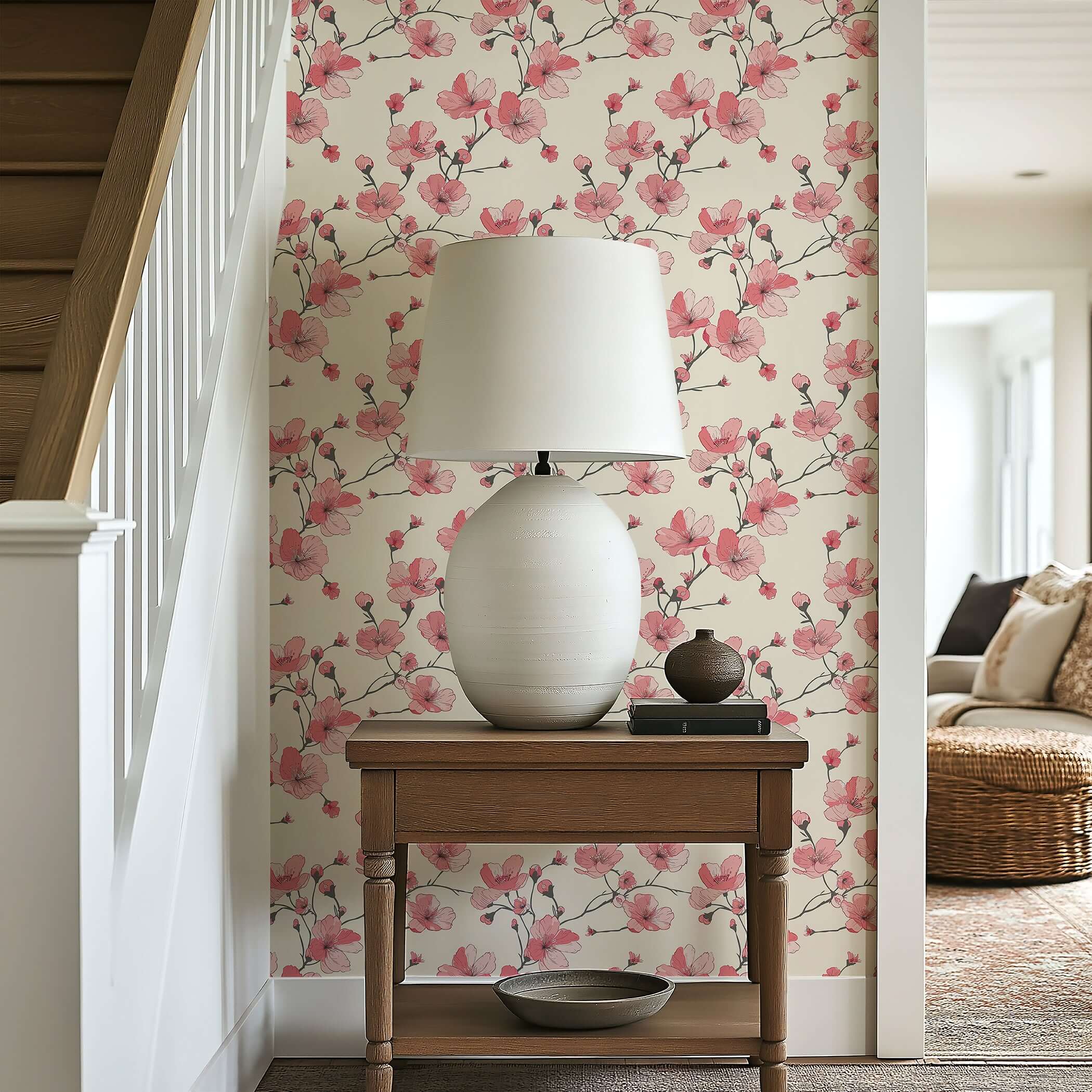 Modern cherry blossom wallpaper in pink and red tones on a tan background, enhancing contemporary decor near a side table with a lamp.
