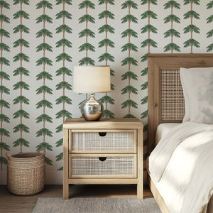 Elegant bedroom with Coastal Chic Palm Oasis wallpaper featuring palm trees, enhancing modern coastal design with a beach vibe.