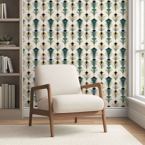 Art Deco wallpaper with peacock feather design in teal and gold, featuring a beige chair in a modern living space.