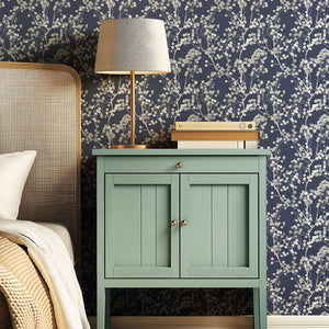 Elegant room with Silver Whisper wallpaper featuring silver branches on a navy background, enhancing modern and contemporary interiors.