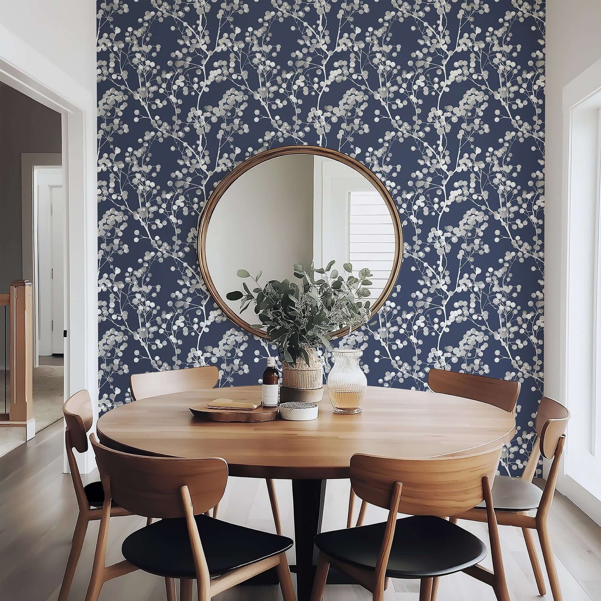 Dining room featuring Silver Whisper wallpaper with silver branches on navy background, creating a modern and contemporary design.