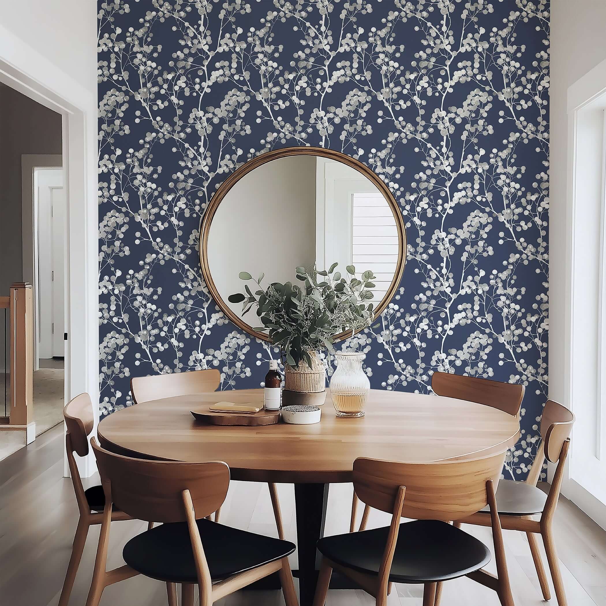 Dining room featuring Silver Whisper wallpaper with silver branches on navy background, creating a modern and contemporary design.