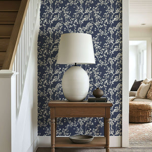 Silver Whisper wallpaper with silver branches on navy background, enhancing a modern and contemporary home interior.