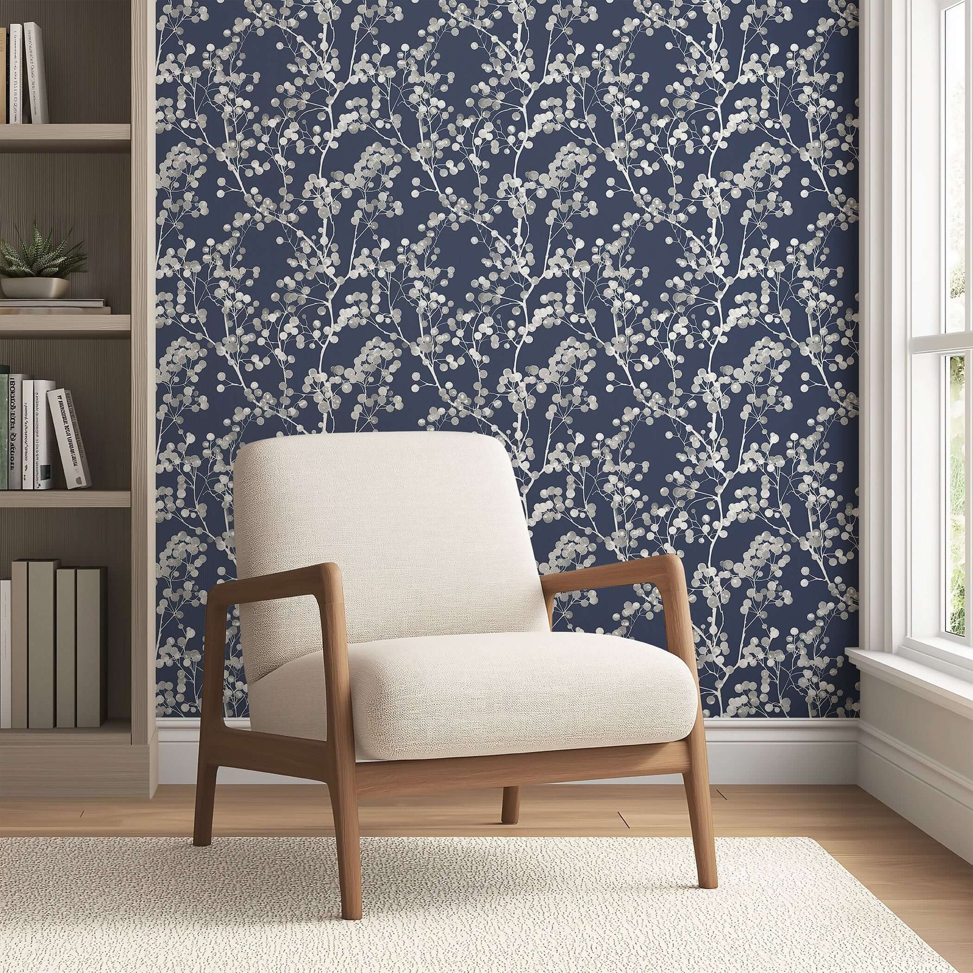 Modern Silver Whisper wallpaper with silver branches on a navy background, creating a sophisticated and contemporary look in a living room.