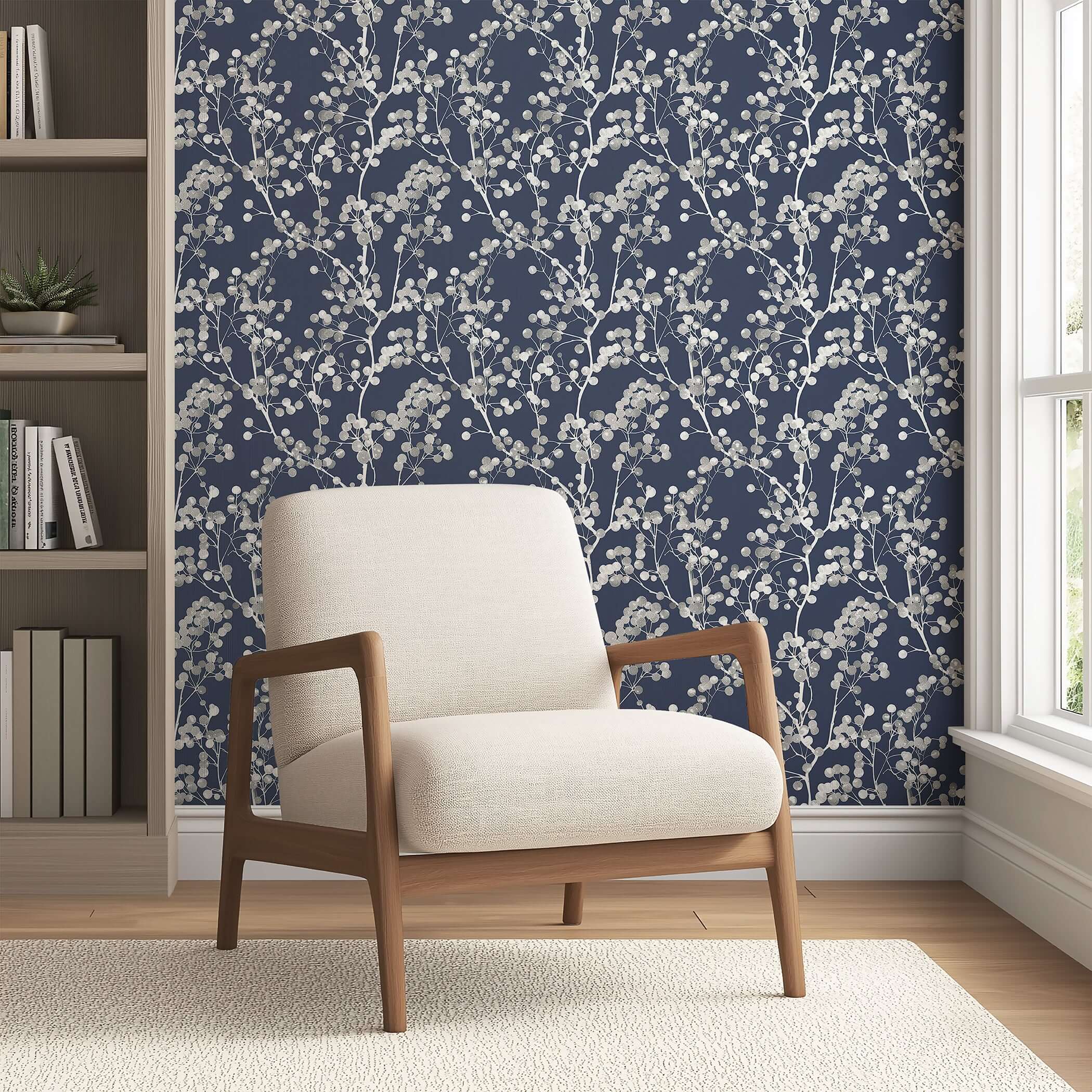 Modern Silver Whisper wallpaper with silver branches on a navy background, creating a sophisticated and contemporary look in a living room.