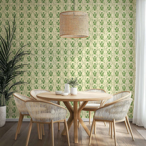 Dining room with Geometric Greenery wallpaper featuring botanical patterns, rattan chandelier, and wooden furniture.