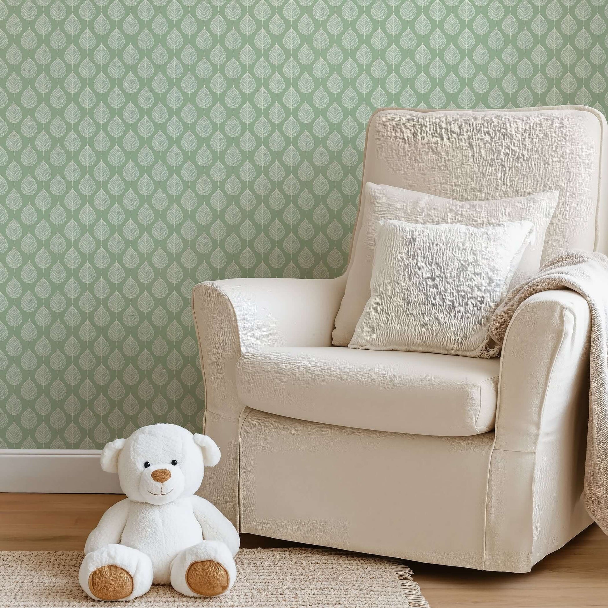 Cozy nursery with Mint Harmony wallpaper featuring white leaf patterns on mint green, modern abstract design for children’s playroom.