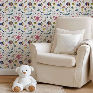 Coastal children's playroom with Underwater Friends wallpaper featuring fish, octopus, and sea animals creating an ocean-themed wonderland.