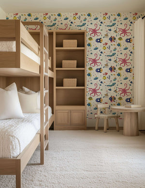 Children's room with Underwater Friends ocean-themed wallpaper featuring colorful fish, octopus, and sea animals, ideal for nurseries.