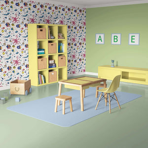 Colorful Underwater Friends wallpaper in children's playroom with ocean-themed fish and coral, creating a creative, coastal atmosphere.