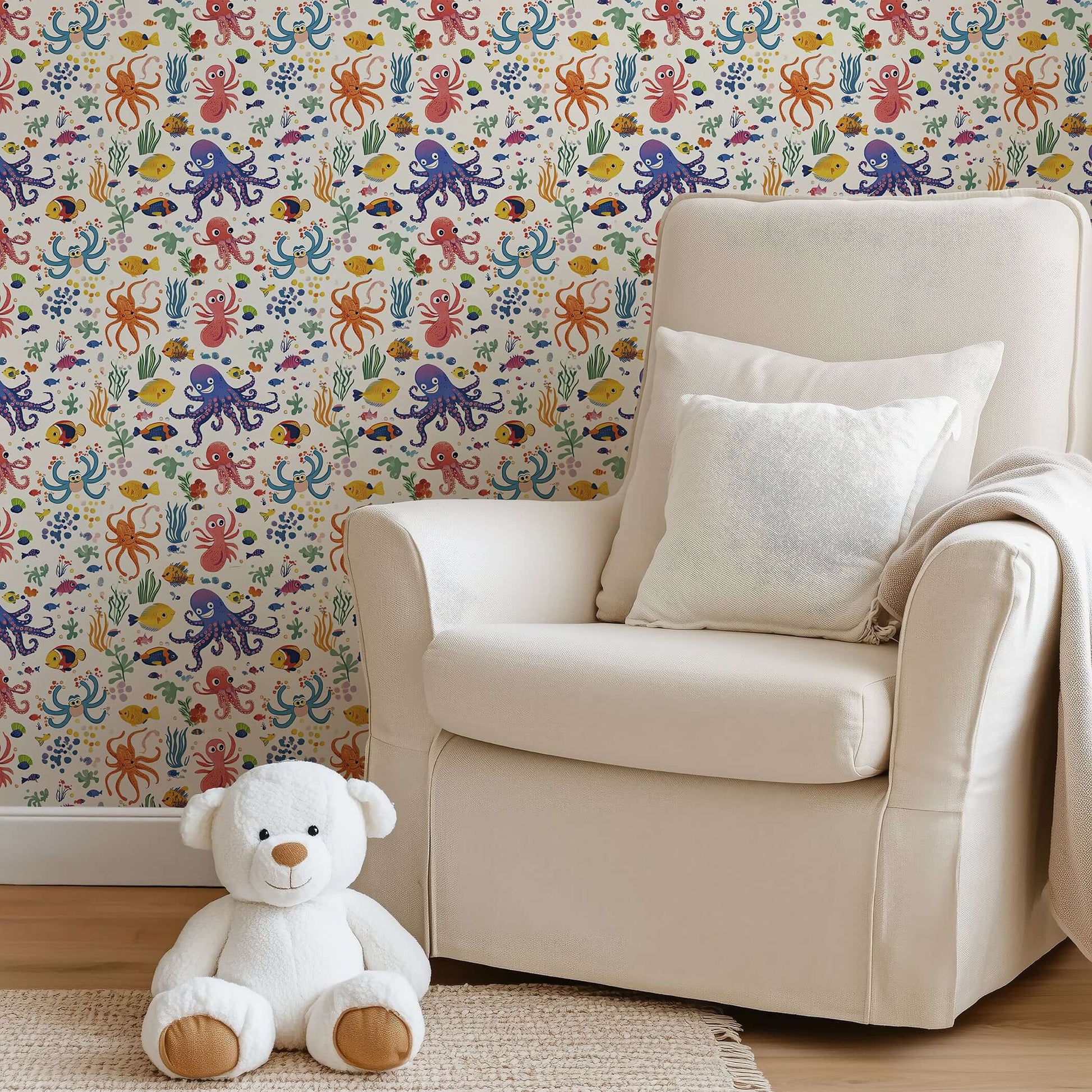 Coastal-themed children's room with "Reef Buddies" ocean wallpaper featuring fish and coral, perfect for nursery playrooms.