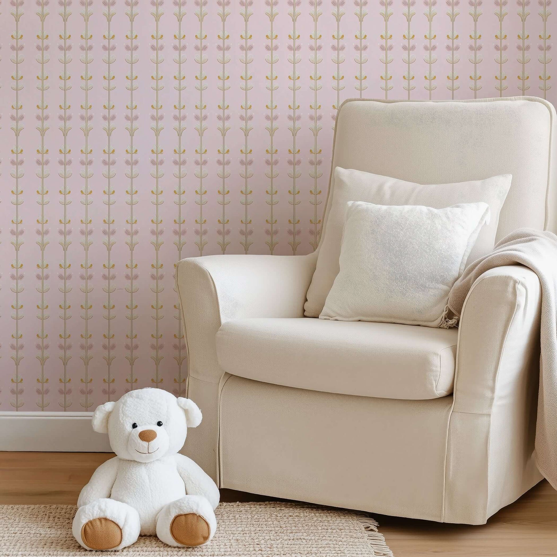 Cozy nursery corner featuring Sugar Blossom Luxe Floral wallpaper with pink and gold florals, an armchair, and a teddy bear.