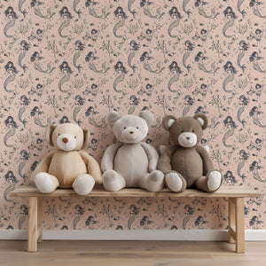 Mermaid Dreams wallpaper in a nursery setting with playful mermaids, seashells, and plush teddy bears on a bench, perfect for children’s rooms.