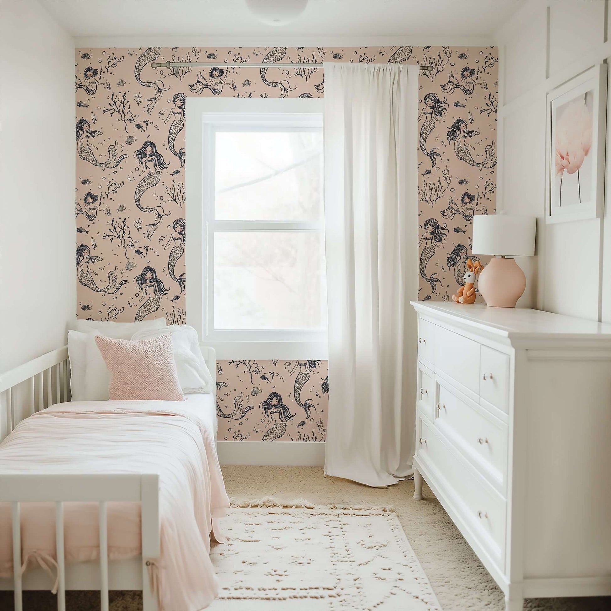 Mermaid Dreams wallpaper in a nursery with mermaids, seashells, blush tones, and coastal charm. Ideal for ocean-themed children’s spaces.