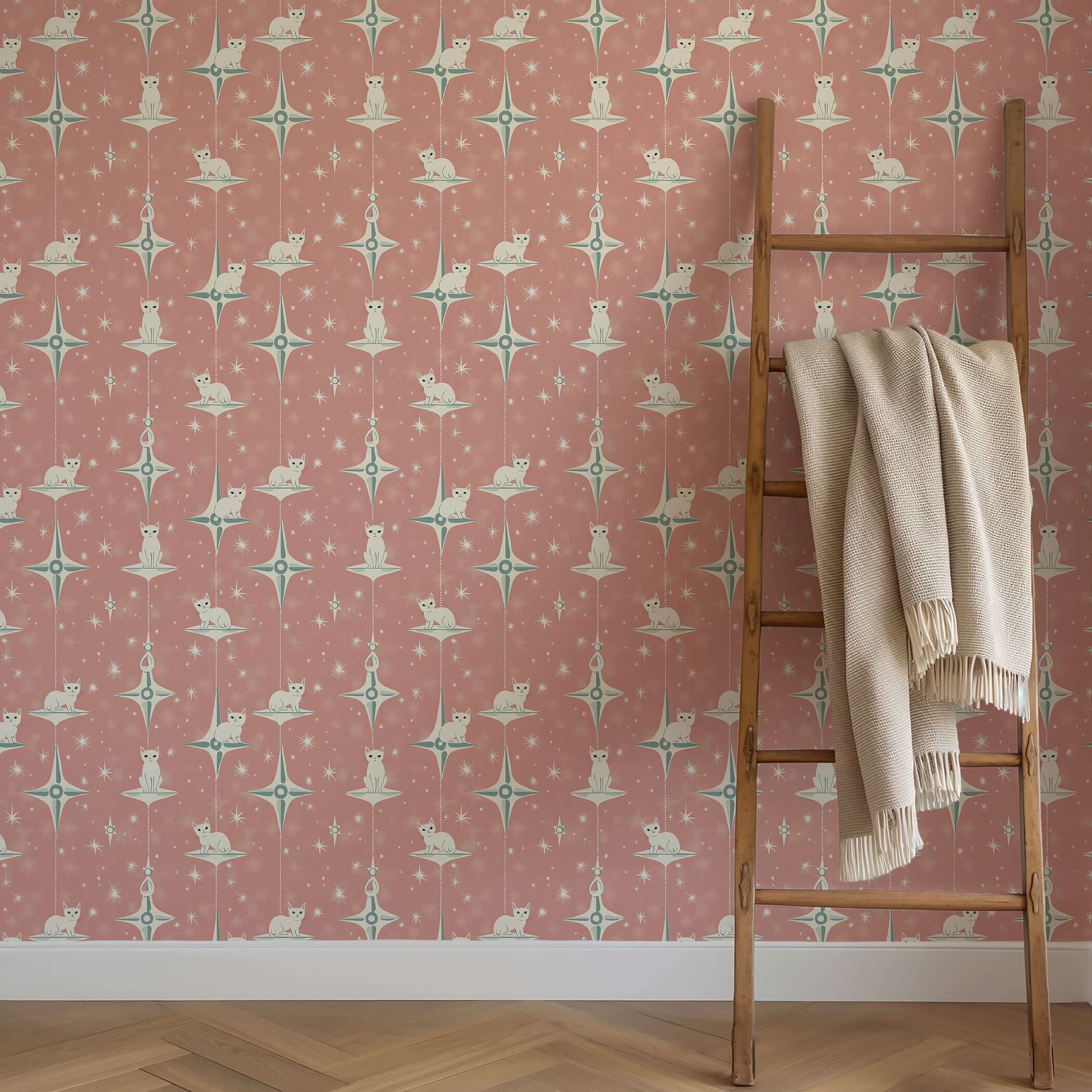 Retro-inspired Starry Kitties wallpaper with white cats and mid-century modern starbursts, perfect for nurseries and playrooms.
