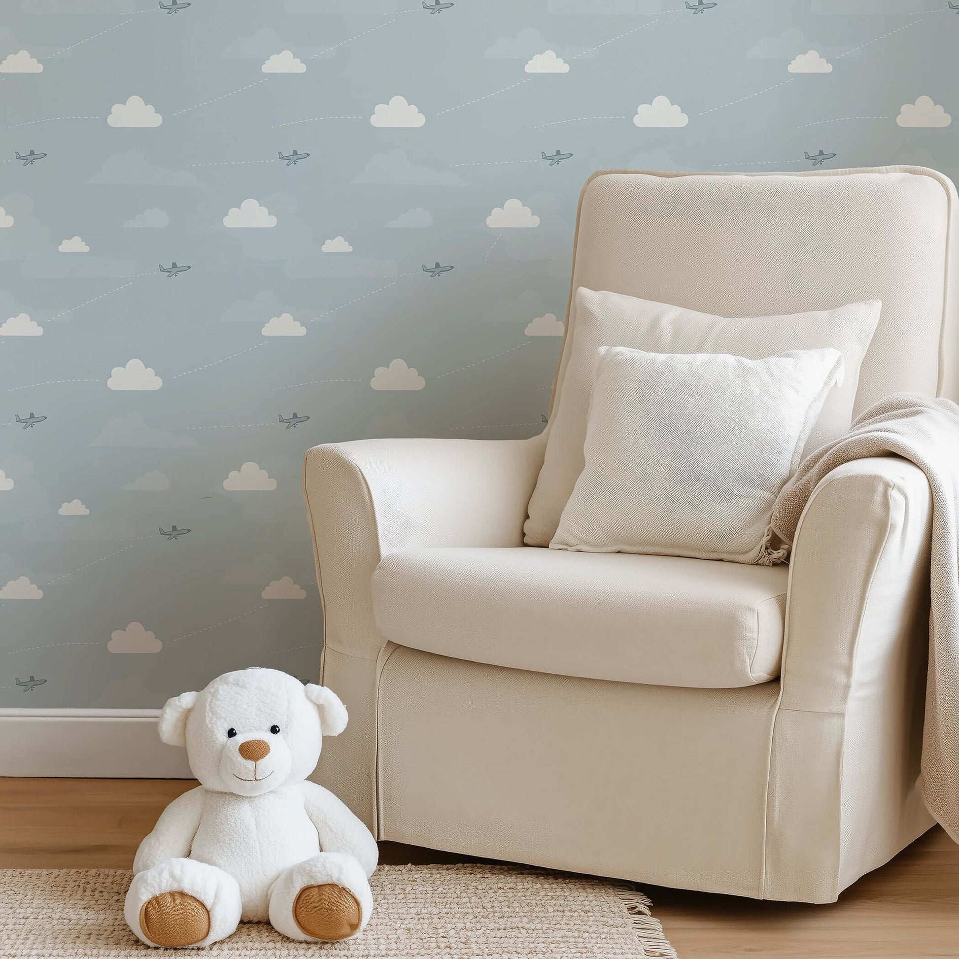 Light blue nursery with Flying High wallpaper featuring airplanes and clouds, perfect for children's room, nursery, or playroom.