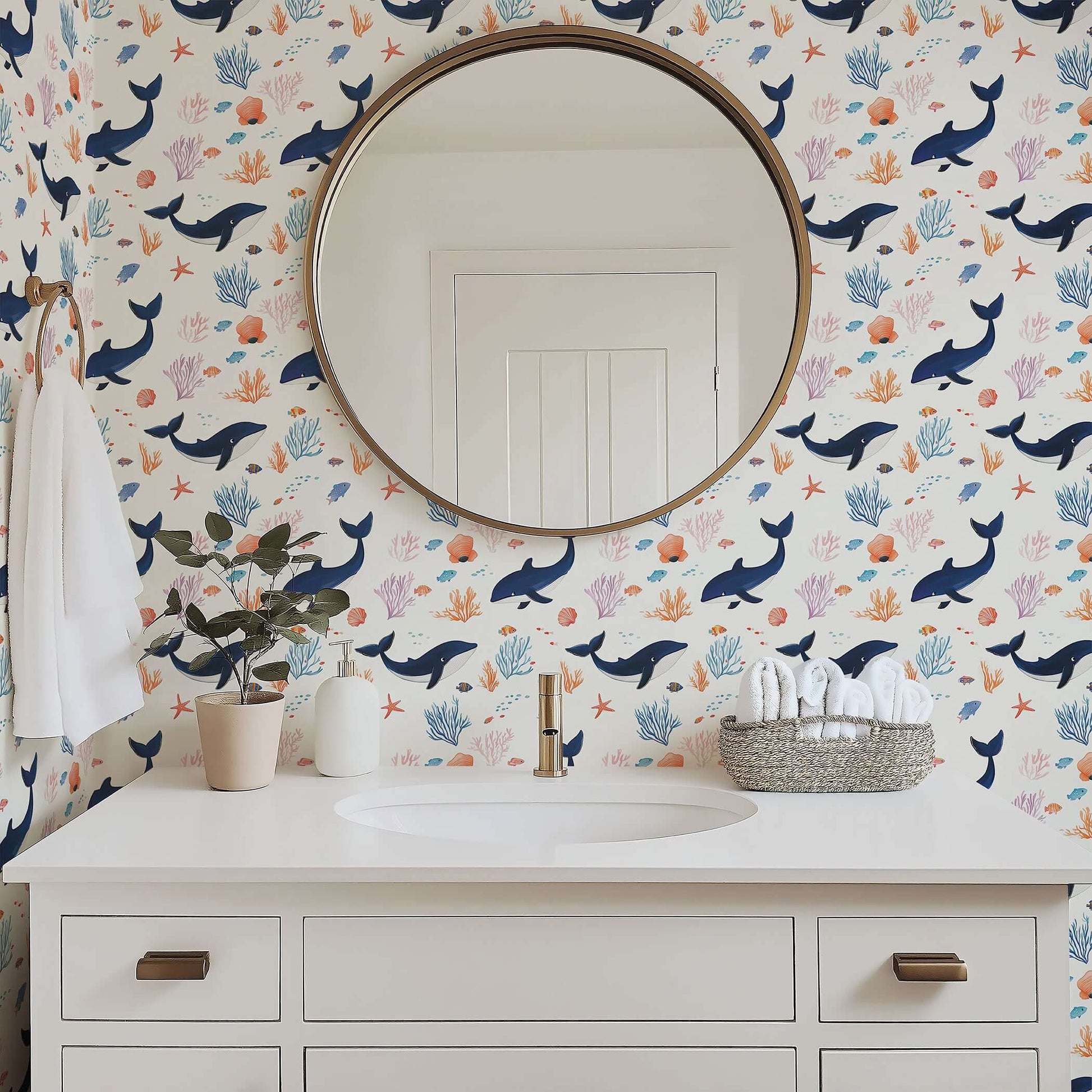 Bathroom with whimsical Whale of a Time coastal wallpaper featuring whales, colorful fish, seaweed, and coral, creating an ocean adventure.