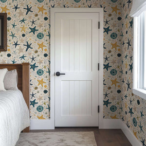 Stellar Starfish Adventure Wallpaper in a cozy room setting, featuring playful sea-themed designs perfect for children's nursery or playroom.