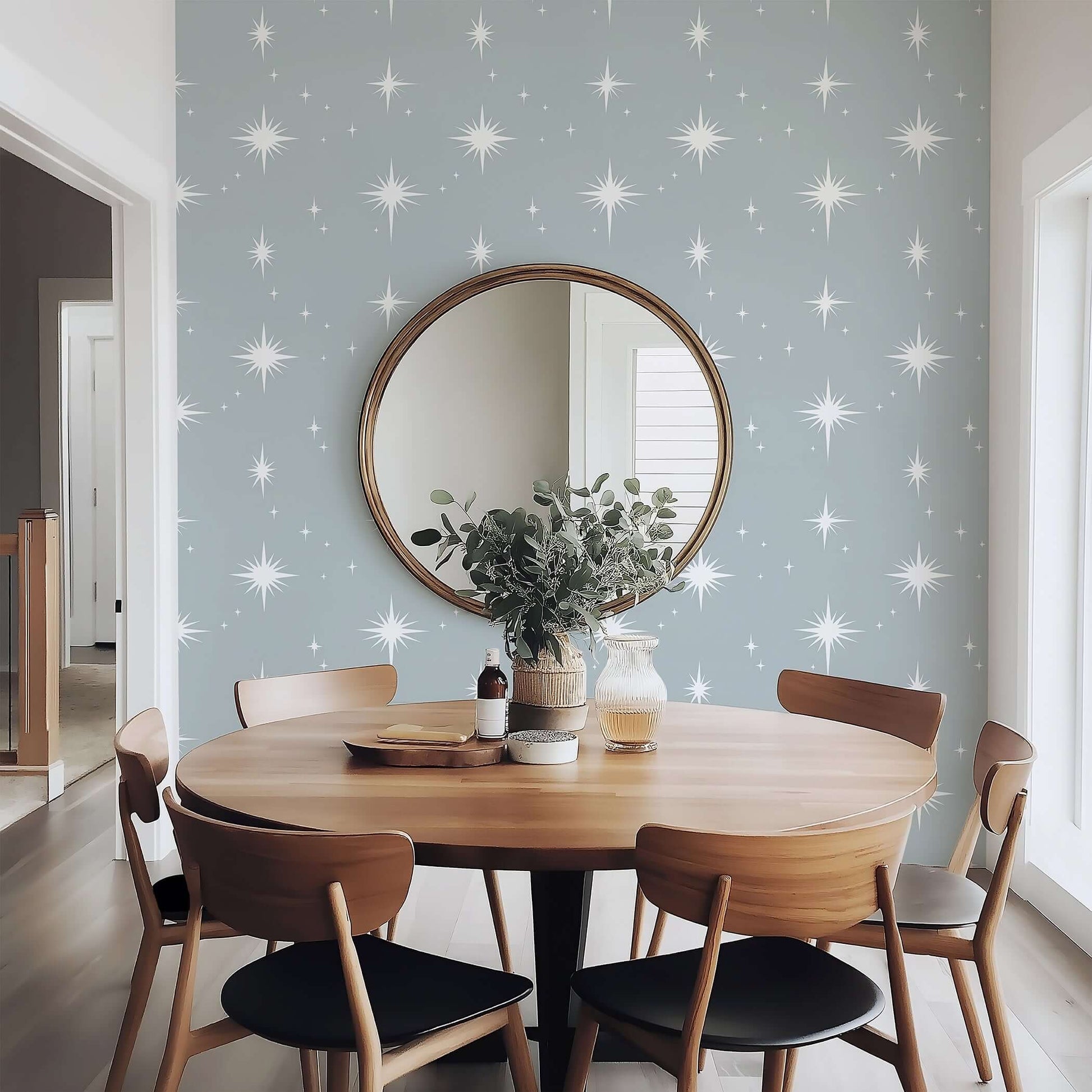 Gray wallpaper with white star design in cozy dining area, perfect for children's nursery or playroom. Dreamy starry night sky theme.