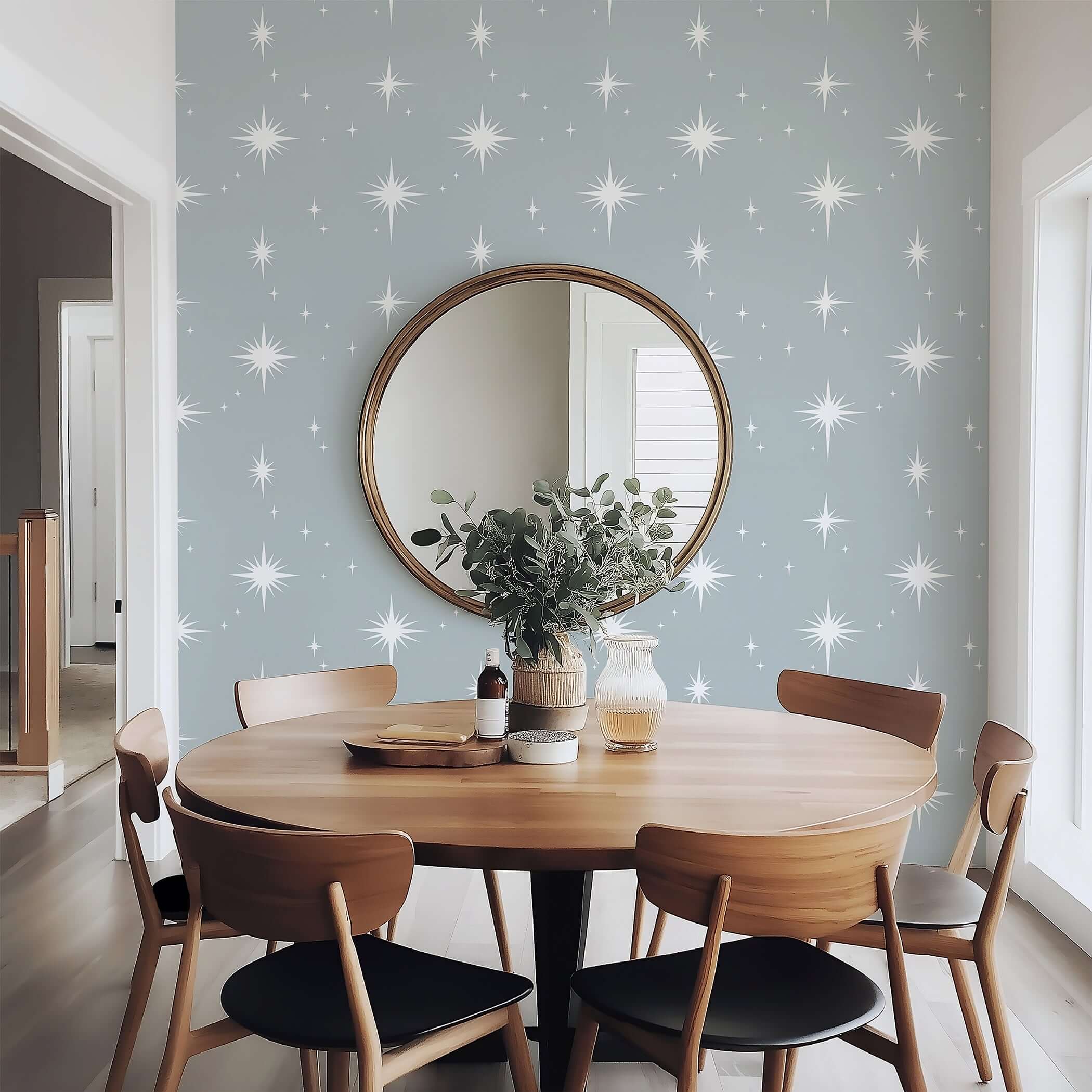 Gray wallpaper with white star design in cozy dining area, perfect for children's nursery or playroom. Dreamy starry night sky theme.