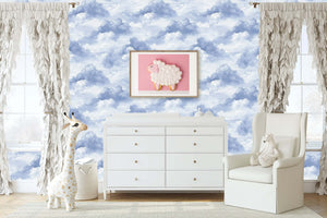 Children's nursery with Serene Cloud Drift wallpaper featuring blue clouds, a plush giraffe, and soft toys, perfect for playrooms.