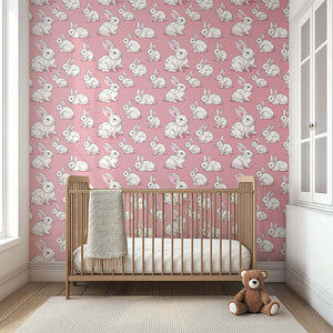 Adorable nursery wallpaper with fluffy white rabbits on mauve-pink, perfect for children's rooms, nurseries, and playrooms.