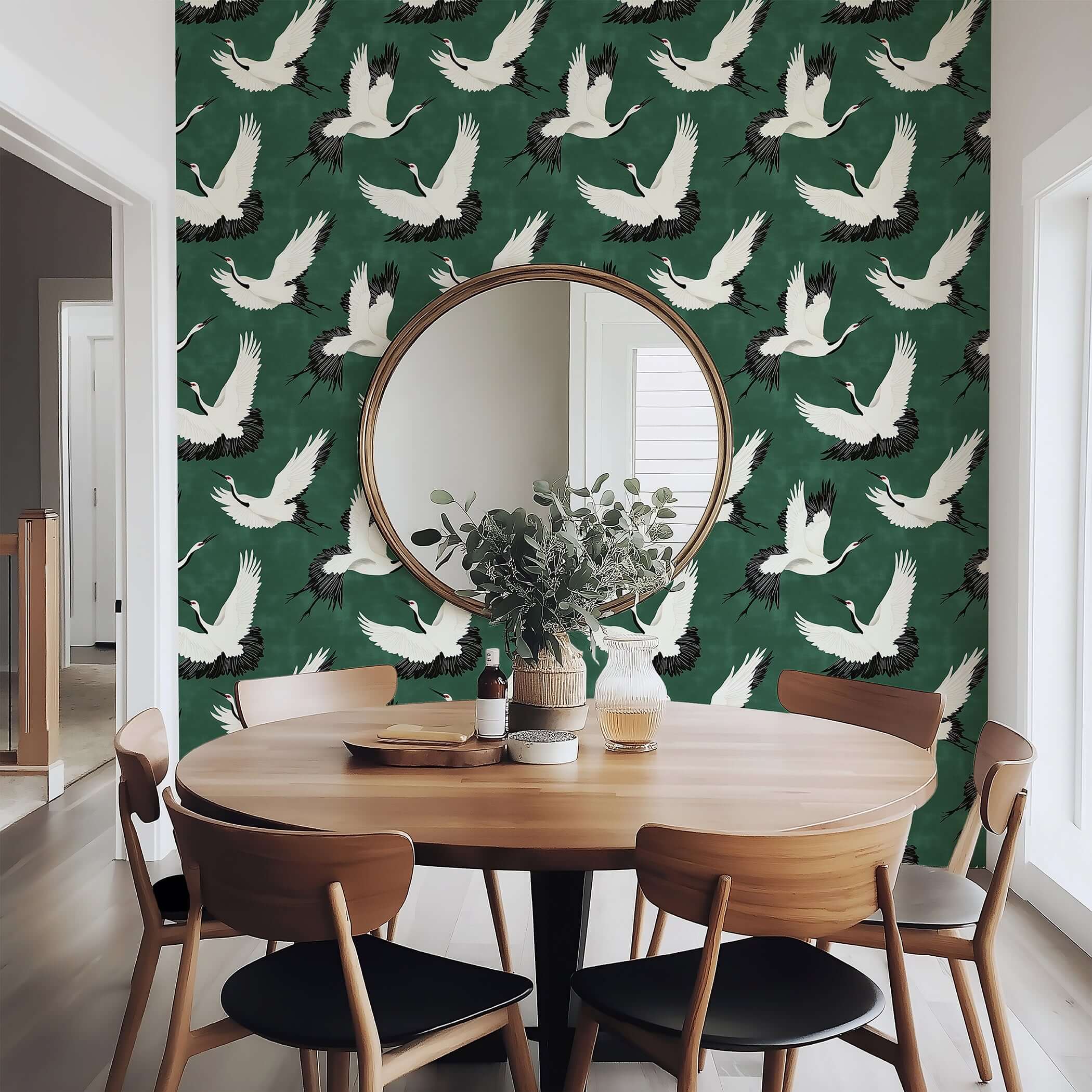"Flight of the Cranes" wallpaper with white cranes on green backdrop, featuring classic and contemporary design in a dining room.