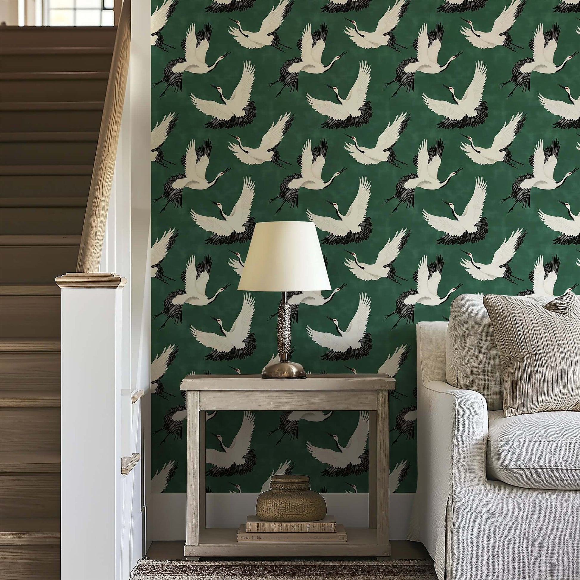 "Flight of the Cranes" wallpaper showcasing white cranes on a green background; perfect for classic or contemporary decor.