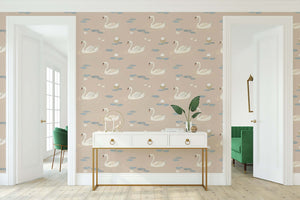 Dreamy Swan Lake wallpaper featuring swans and lily pads on taupe, ideal for mid-century modern decor and serene pond ambiance.
