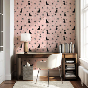 Twilight Catscape wallpaper with black cats, mid-century stars on blush backdrop. Ideal for nurseries, playrooms, or accent walls.