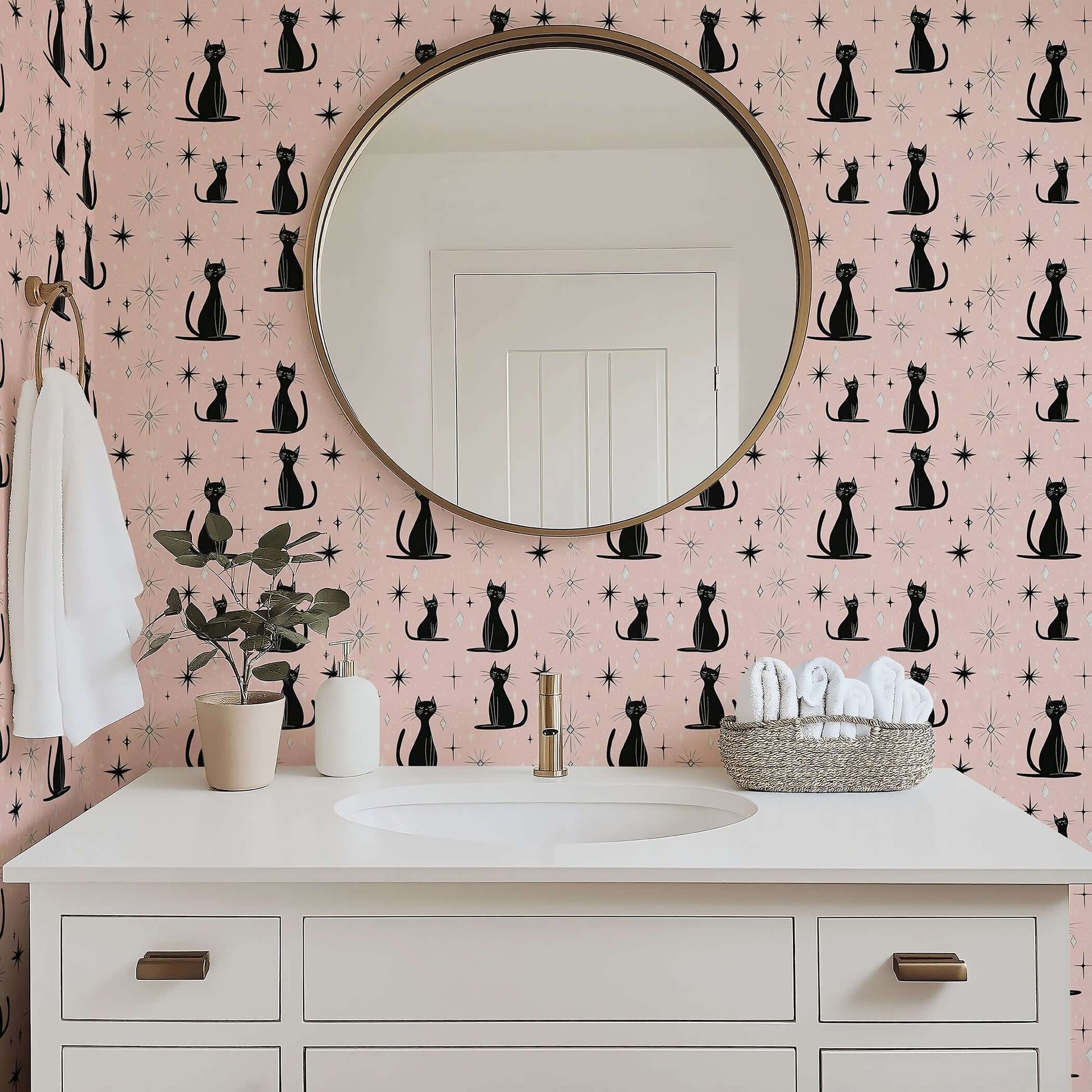 Mid-century modern wallpaper featuring black cats and starbursts on pink, perfect for nurseries, playrooms, and spaces with charm.