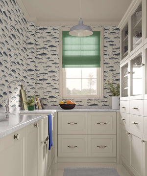 Vintage fisherman wallpaper with fish illustrations in a coastal-themed kitchen, showcasing oceanic charm and refined elegance.