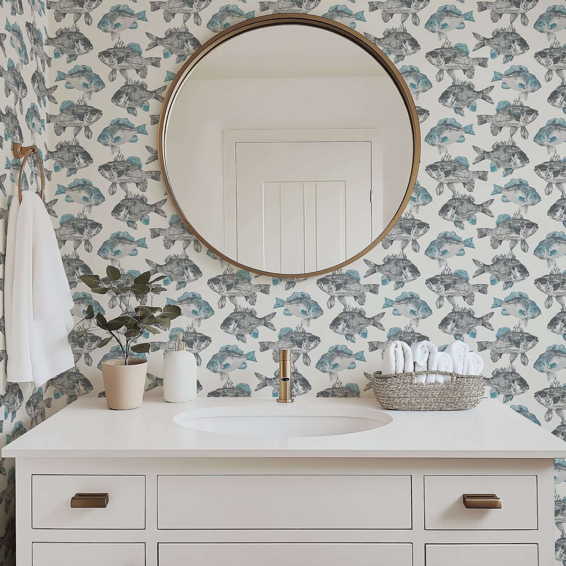 Bathroom with Coastal Currents wallpaper featuring hand-drawn fish, providing a serene nautical and coastal design backdrop.