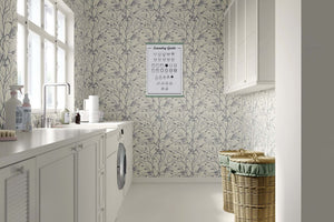 Monochrome songbird wallpaper enhancing a serene laundry room with nature-inspired elegance and sophisticated design.
