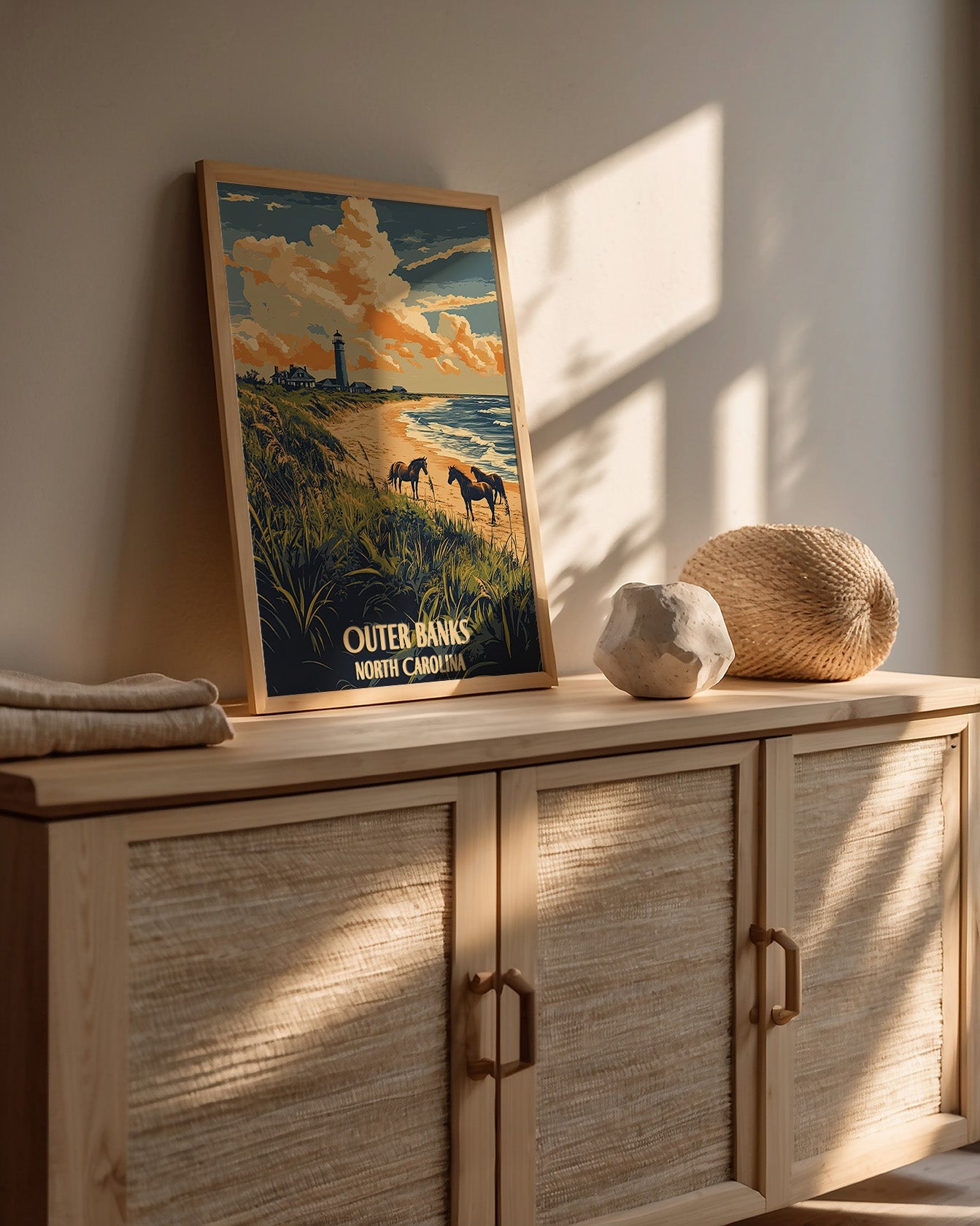 Vintage travel poster of Outer Banks, North Carolina, featuring wild horses, a lighthouse, and beach scenery.