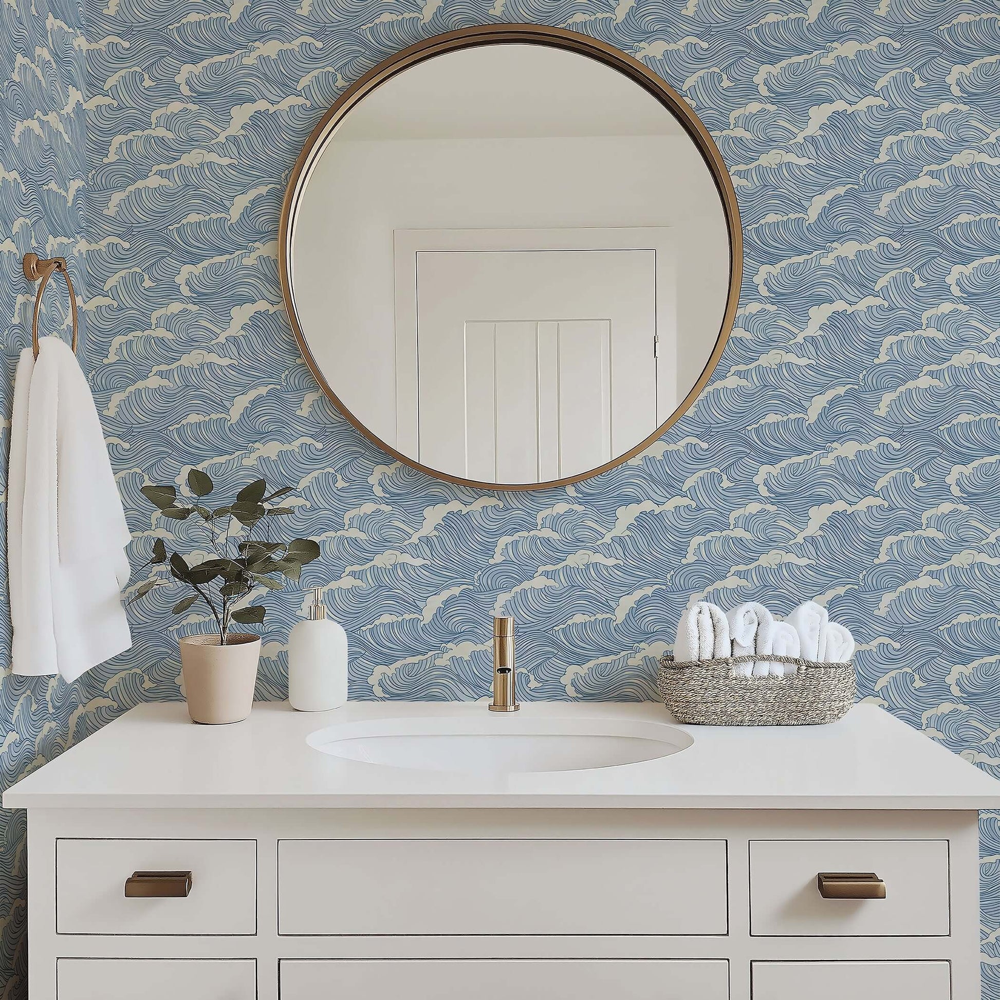 Coastal bathroom with Ocean Serenity wallpaper featuring wave designs in blue, enhancing maritime tranquility and coastal decor.