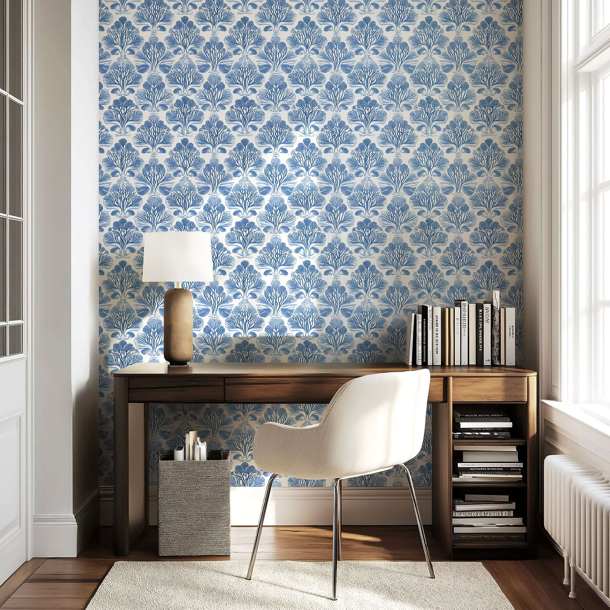 Elegant room with Coastal Luxe Coral wallpaper featuring blue coral reef damask pattern, wooden desk, and chair for a serene ocean-inspired decor.