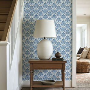 Coastal Luxe Coral wallpaper with blue coral damask pattern, enhancing an ocean-inspired aesthetic in a serene interior hallway.