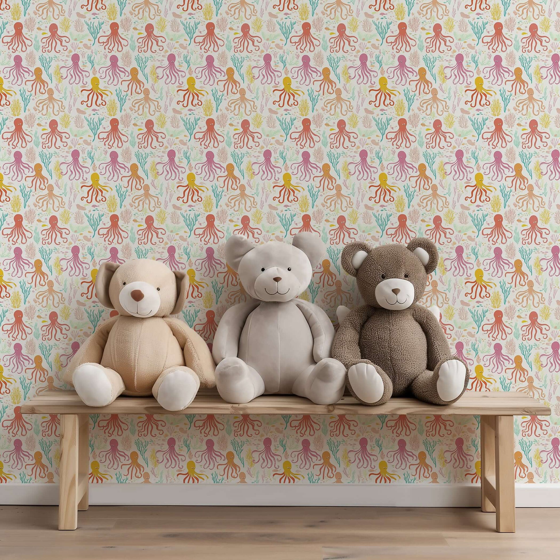 Playful Coral Cove octopus wallpaper in nursery with teddy bears, perfect for coastal-themed children's rooms and playrooms.