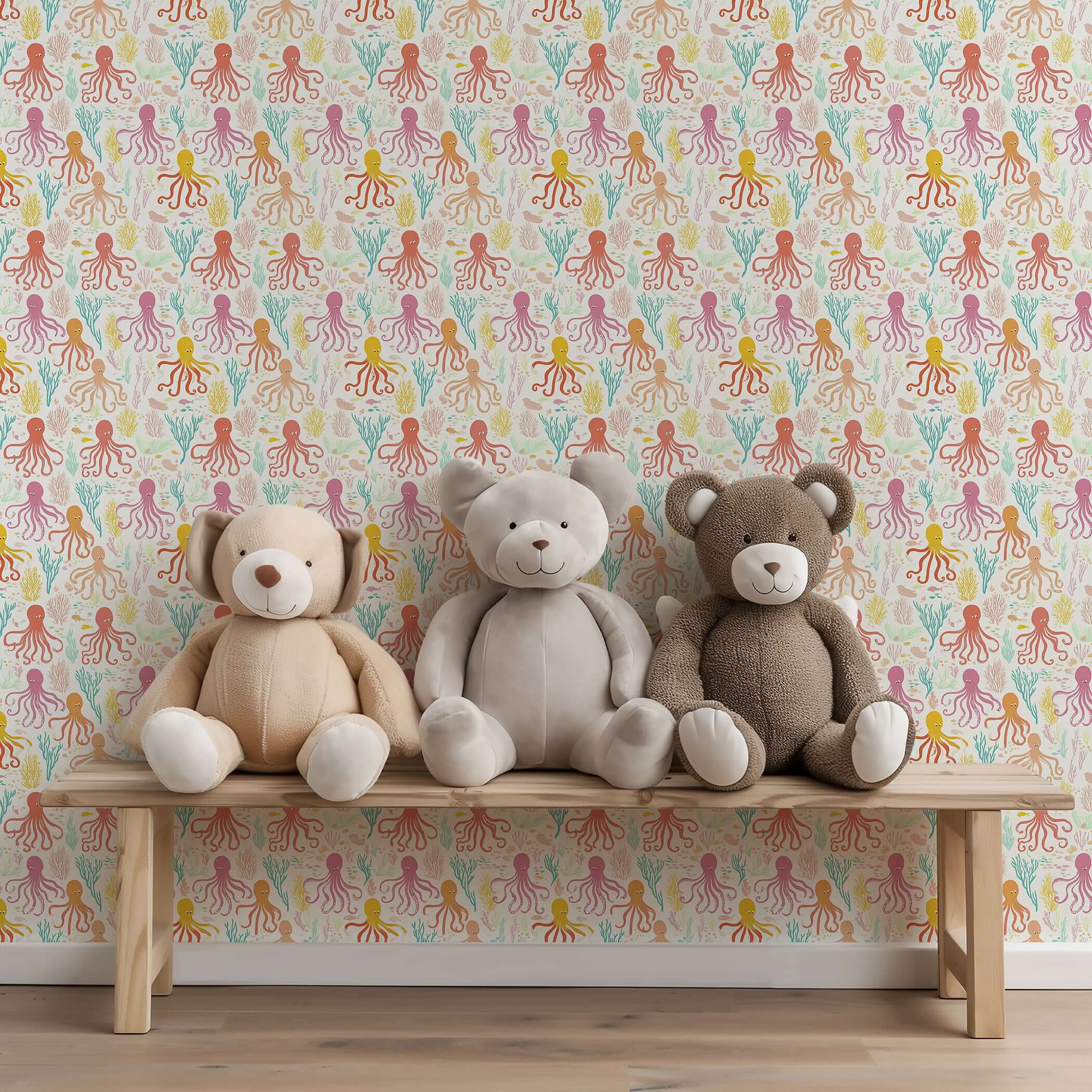 Playful Coral Cove octopus wallpaper in nursery with teddy bears, perfect for coastal-themed children's rooms and playrooms.