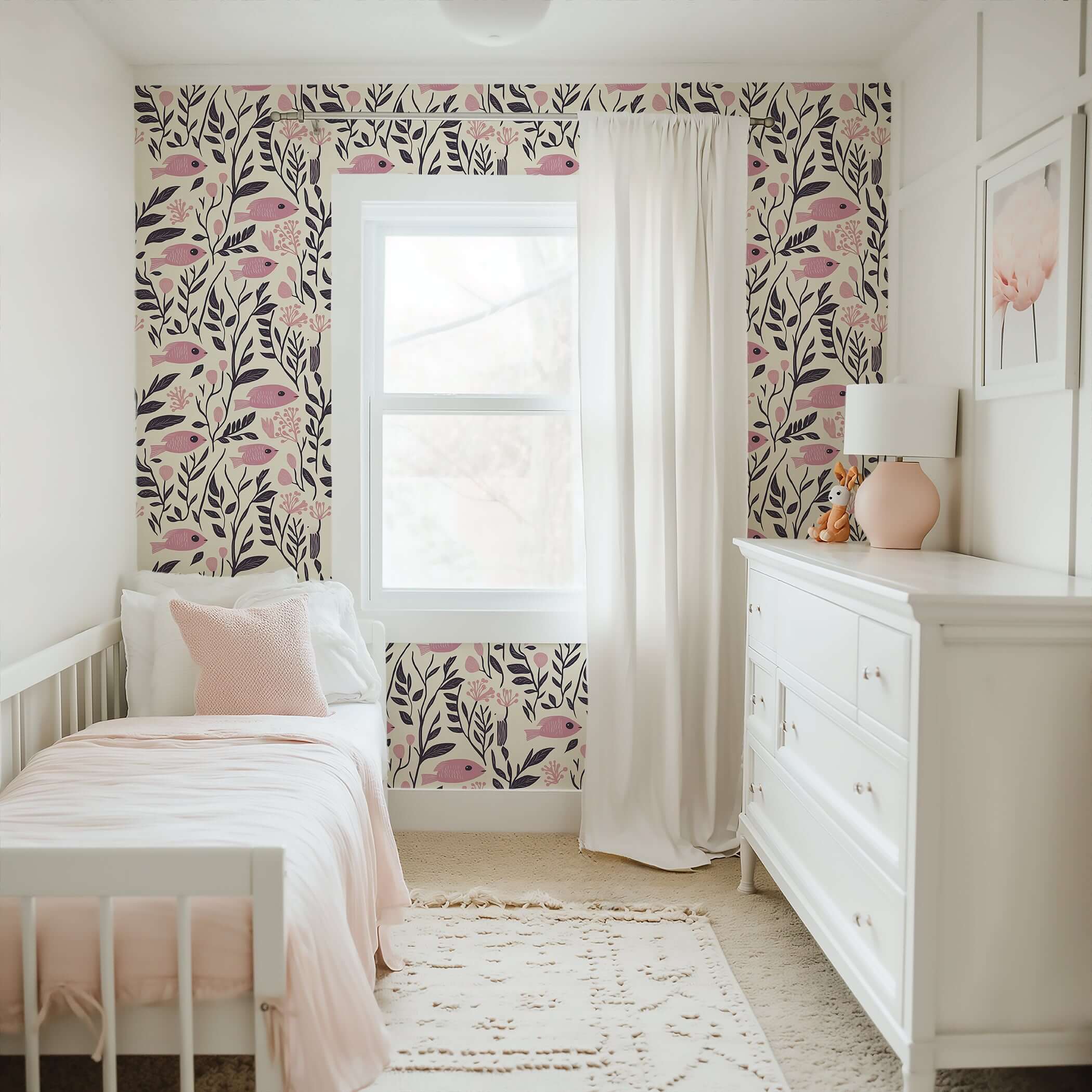 Nursery room with Vintage Fish Garden Wallpaper featuring pink fish and floral designs, creating a whimsical, coastal mid-century modern vibe.