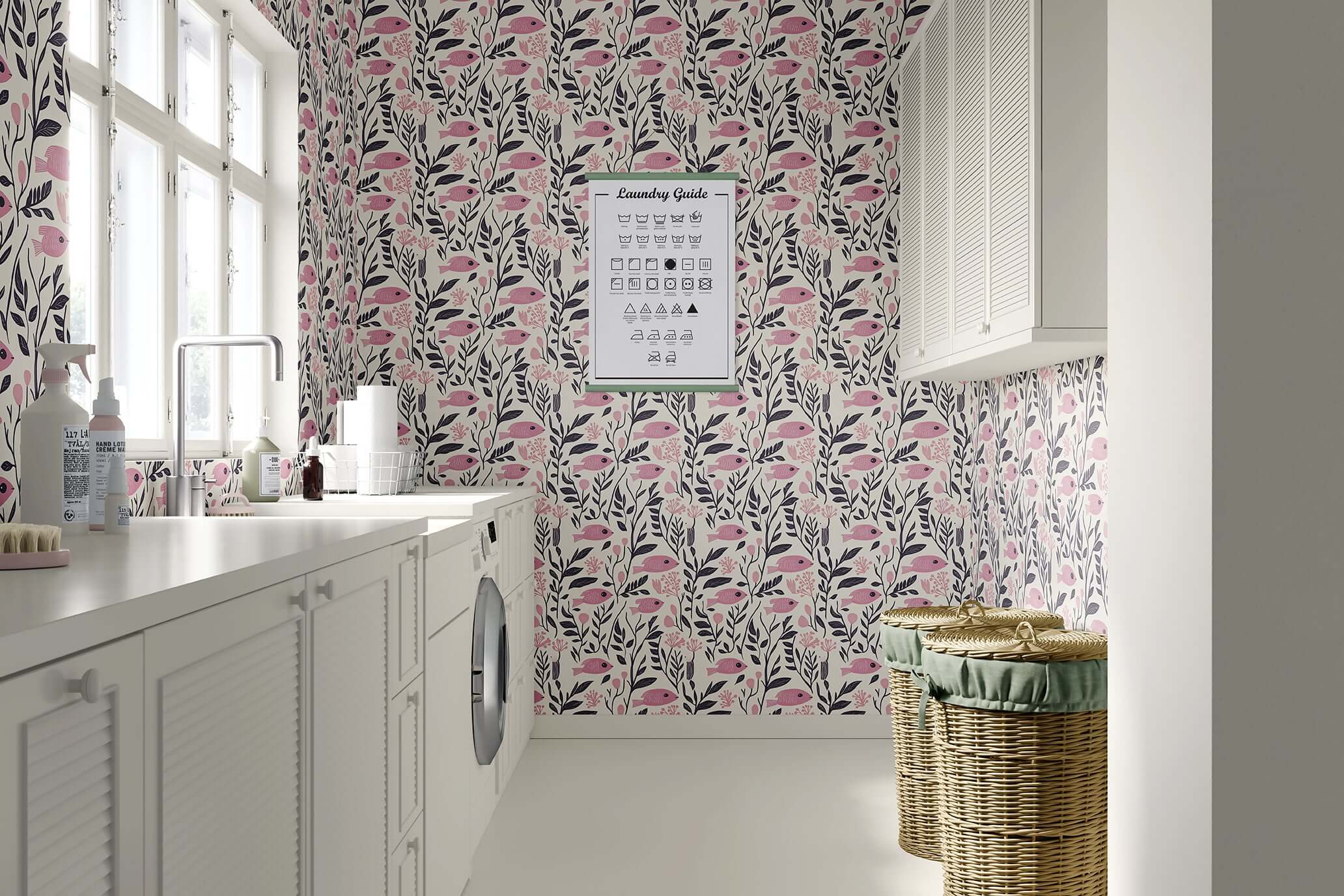 Vintage fish garden wallpaper with pink fish and floral design in a bright laundry room, enhancing coastal and mid-century modern decor.
